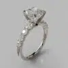 Graduated Side Stone Cushion Cut Moissanite Engagement Ring
