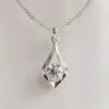Moissanite Solitaire Pendant in an Elegant Teardrop Setting