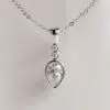 Trio Bezel Set Pear Moissanite Pendant