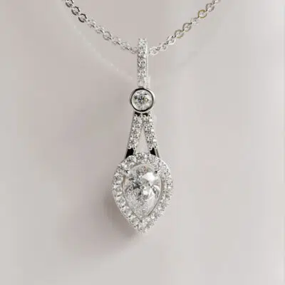 Pear-Cut Moissanite Pendant with Bezel-Set Accent and Halo